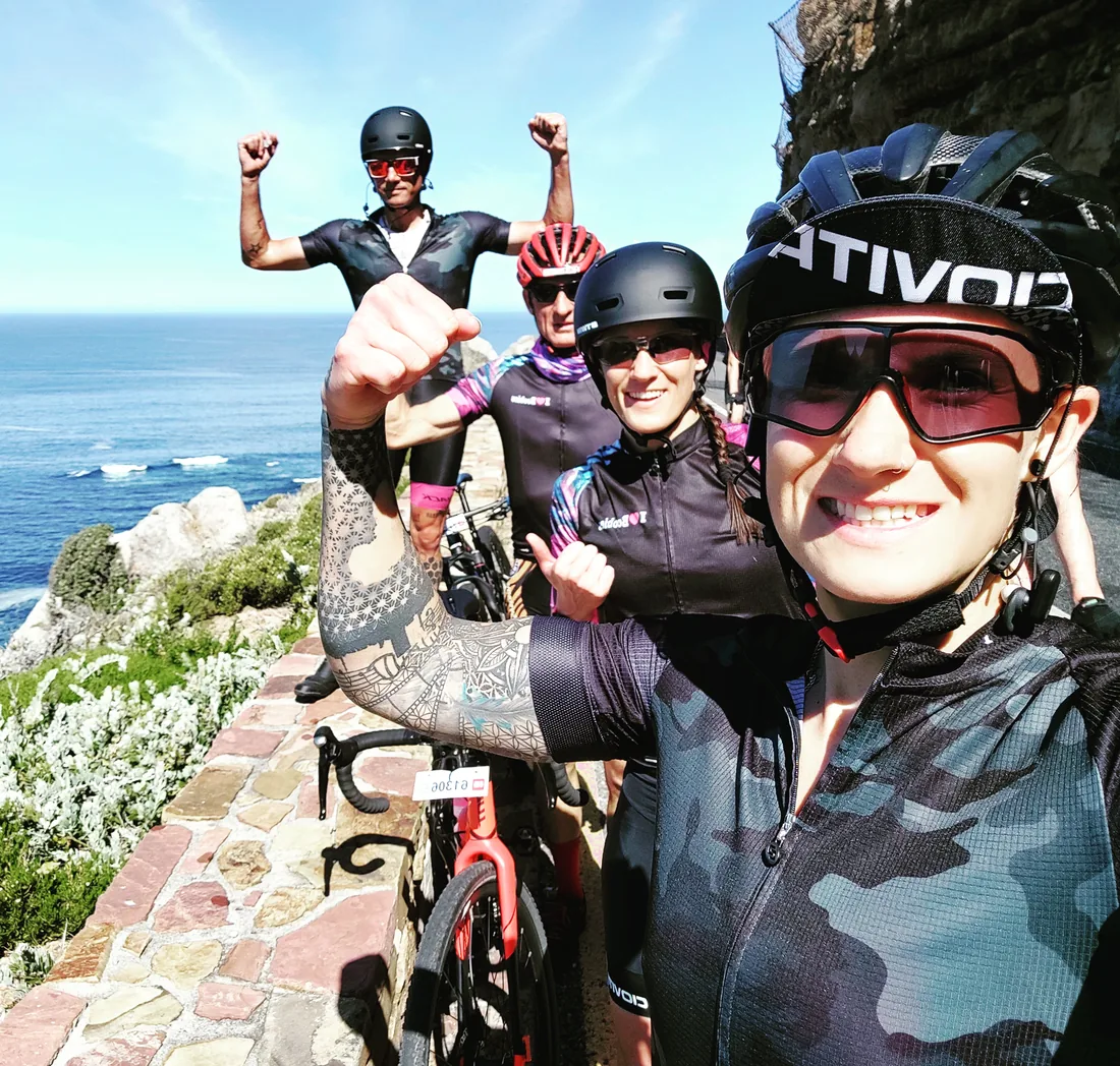 Christilee Jansen riding the coast road with three others