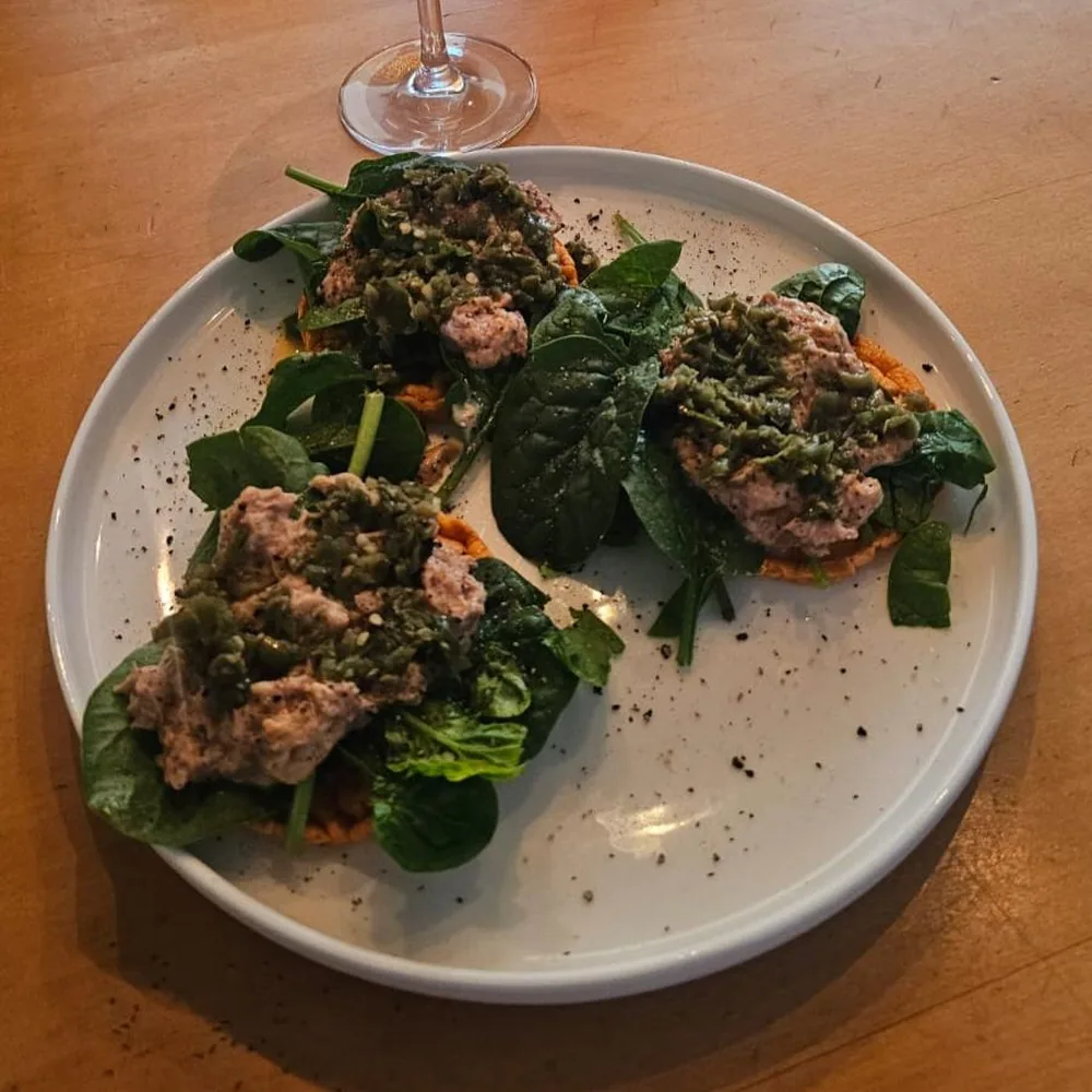 Protein and greens on sweet potato rounds